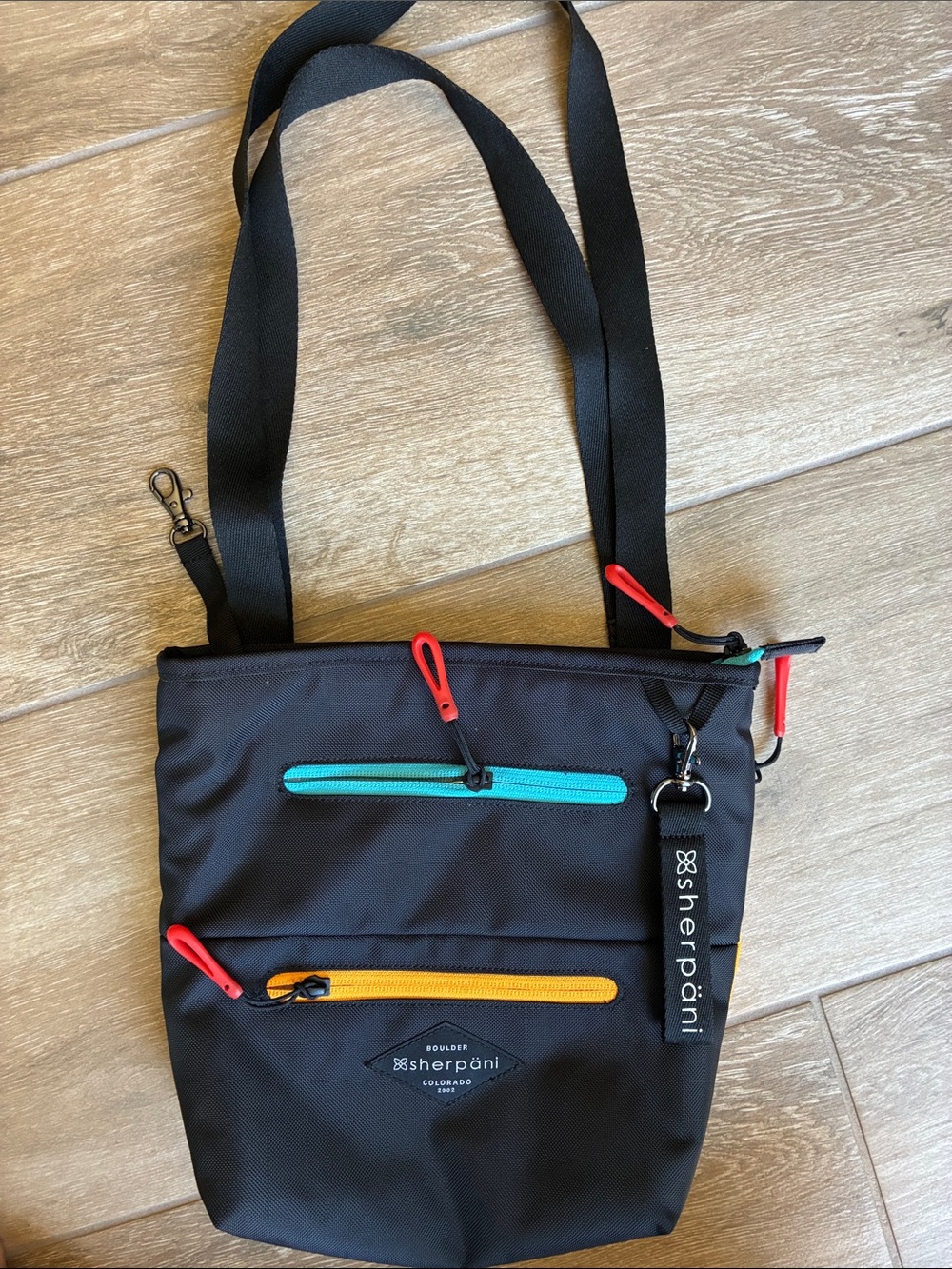 Sherpani Black  Bag with Teal and Yellow Accents